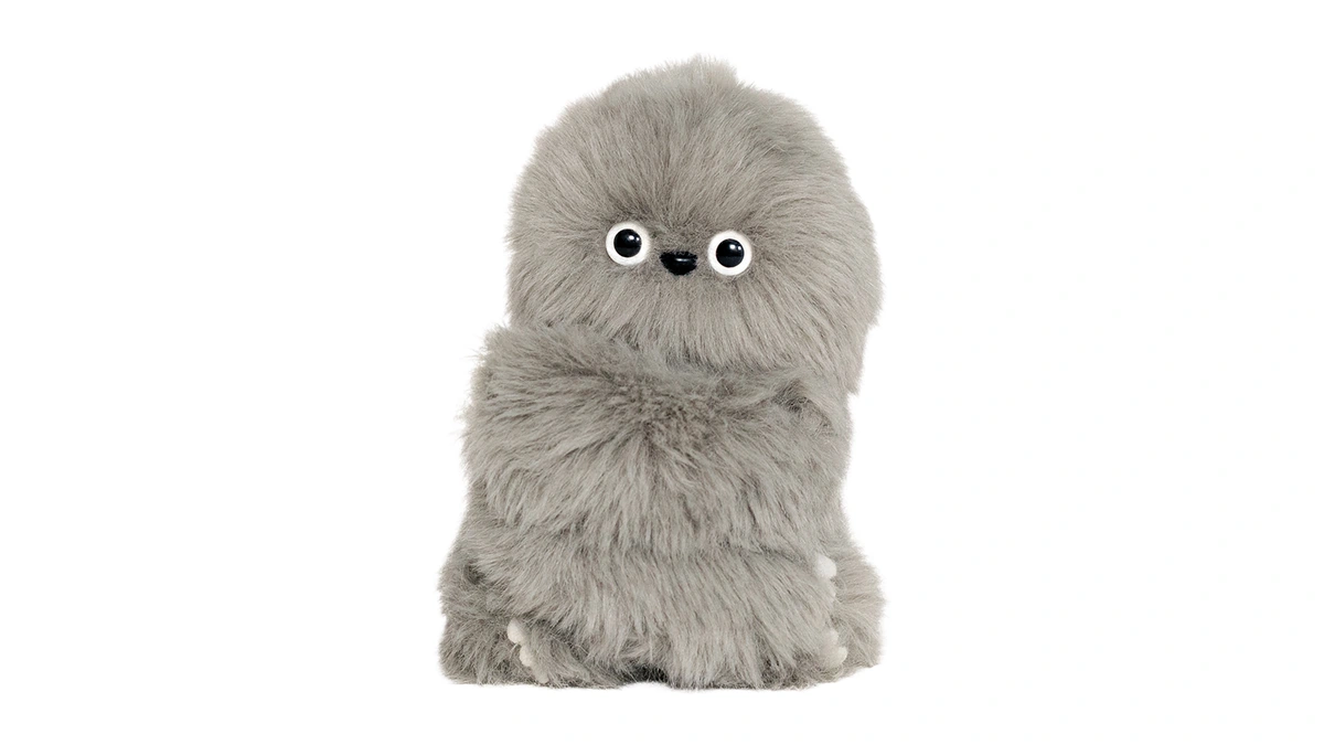 Front view of the gray Mirumi plush robot, showing its round eyes and long arms