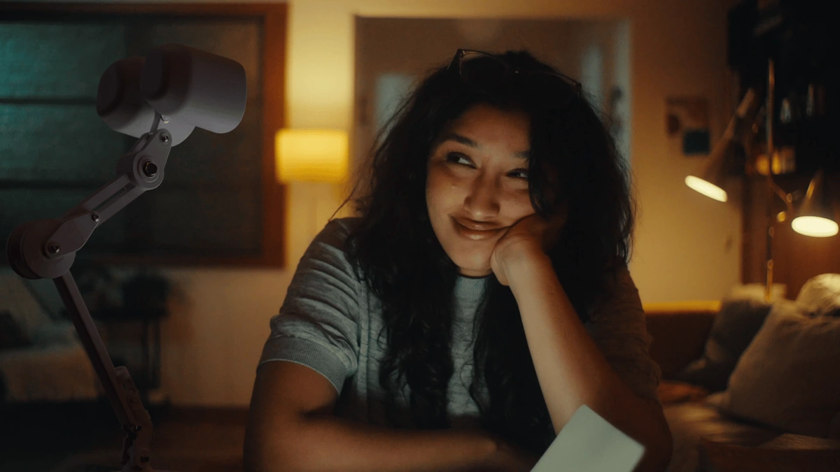 Ongo's two round lamp heads face a person across a desk on a jointed support arm in an official promotional image